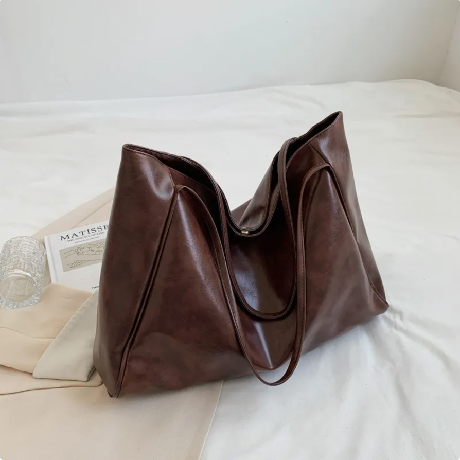 Glossy Retro Tote Bag Stylish Vintage in beige color on a light background, highlighting its spacious design.