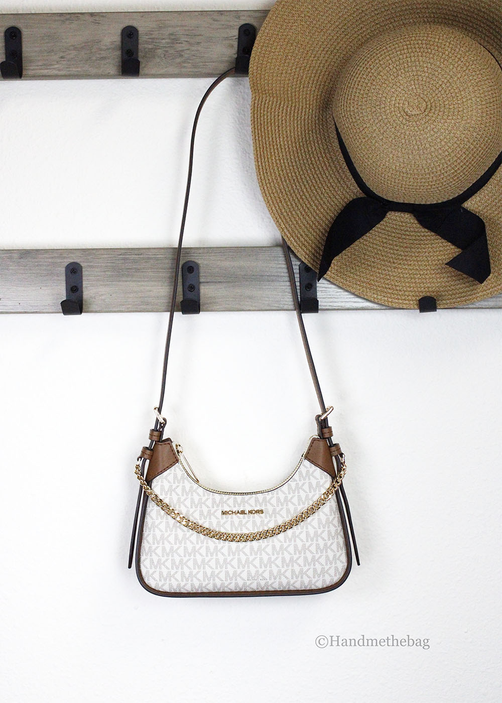 Michael Kors Wilma Small Vanilla PVC Chain Crossbody Bag featuring a chic design with signature PVC material and gold chain.
