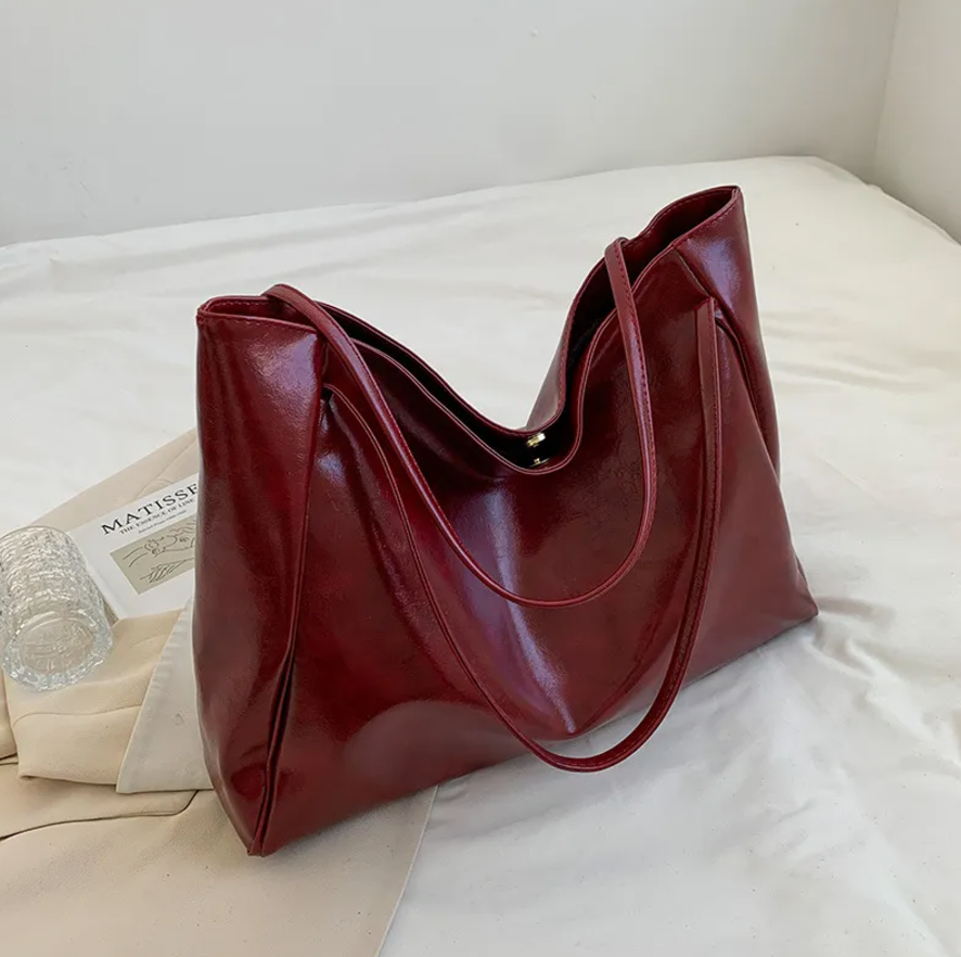 Glossy Retro Tote Bag Stylish Vintage in beige color on a light background, highlighting its spacious design.