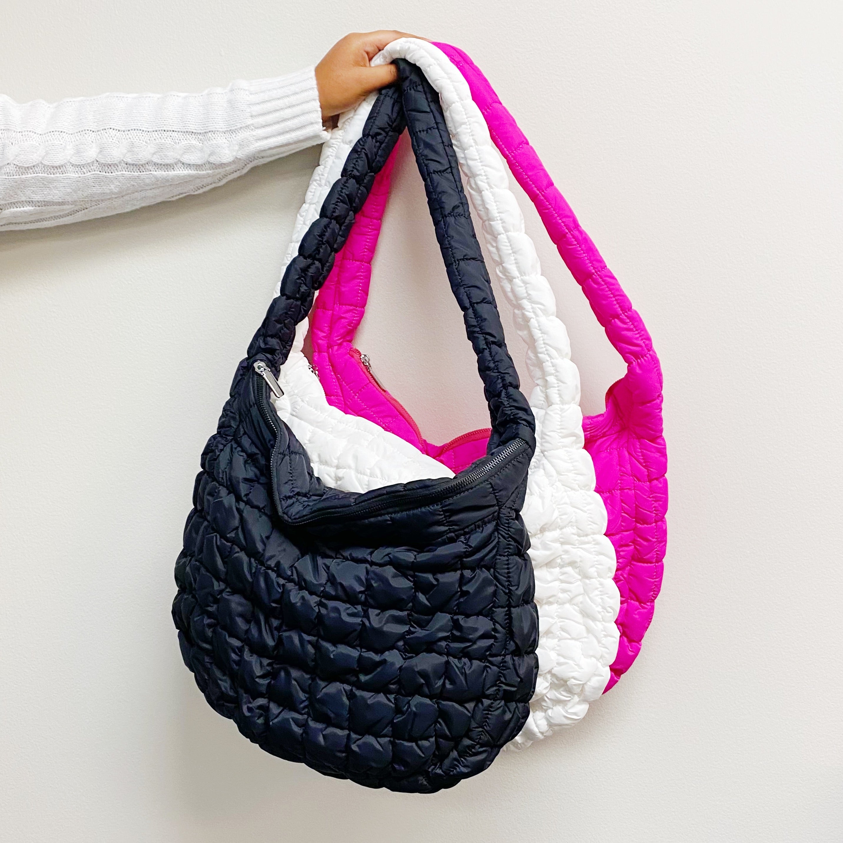 Carry All Quilted Cross Body Bag in black, white, and pink showcasing stylish quilted design.