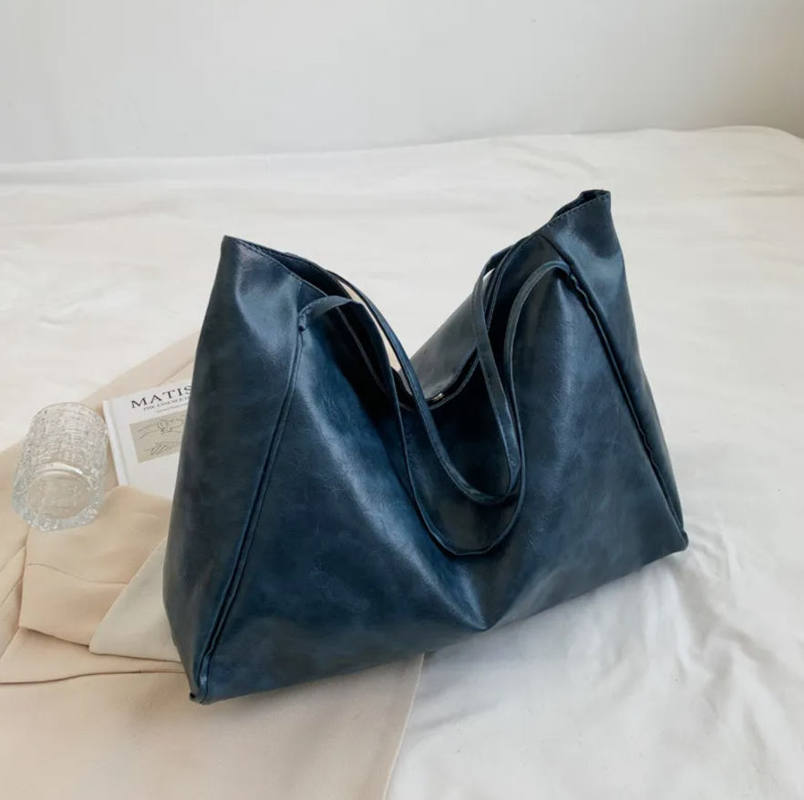 Glossy Retro Tote Bag Stylish Vintage in beige color on a light background, highlighting its spacious design.