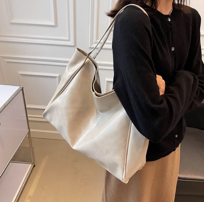 Glossy Retro Tote Bag Stylish Vintage in beige color on a light background, highlighting its spacious design.